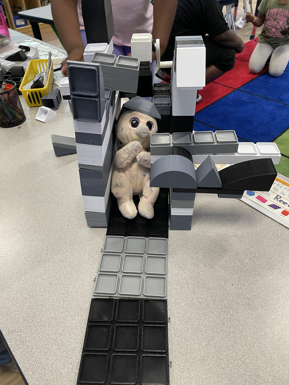 Creative block structure with a toy figure beneath its arch