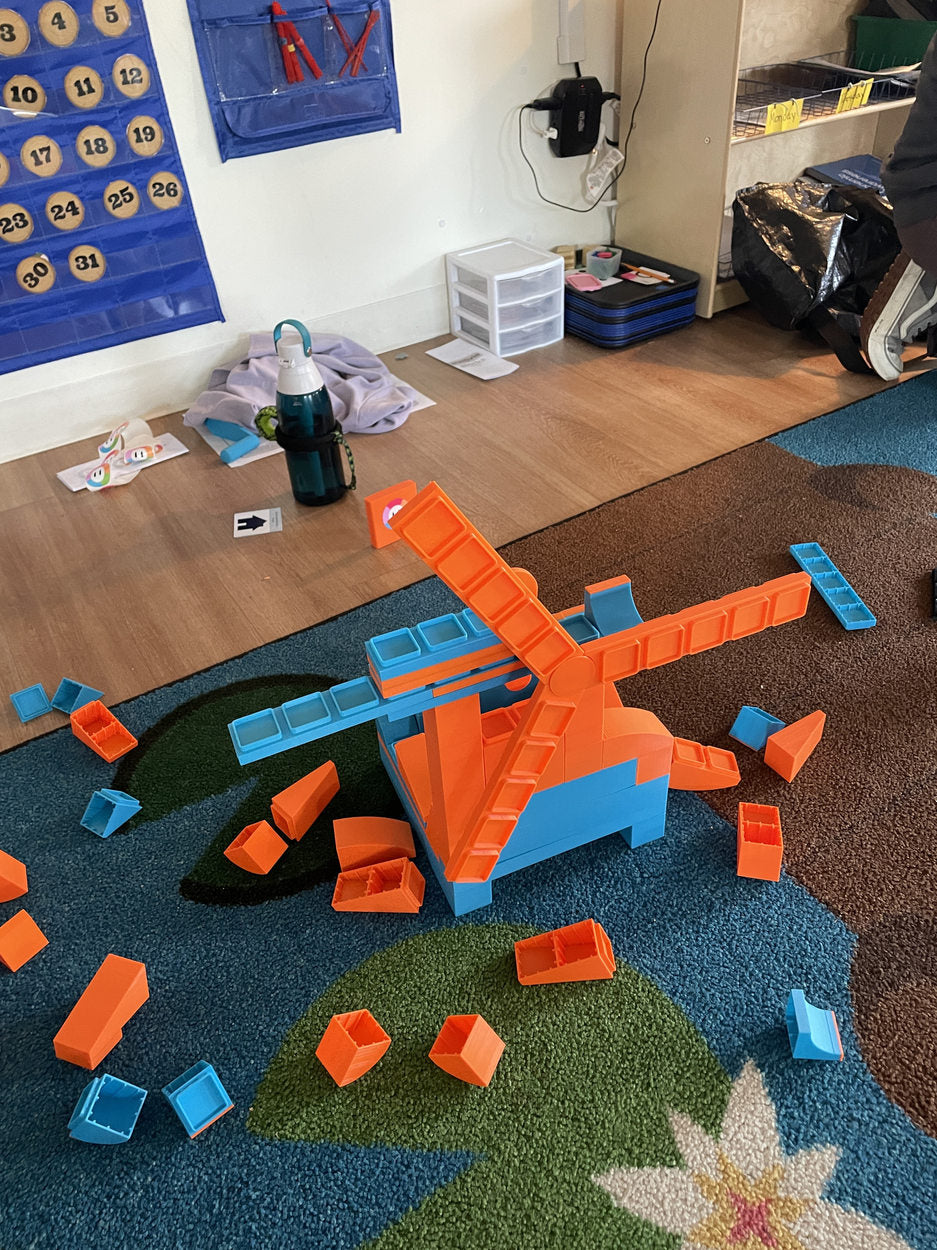 Orange-and-blue blocks in a classroom playtest