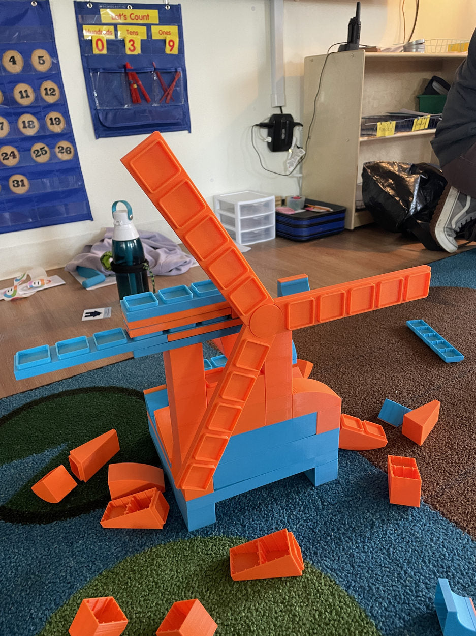 A completed orange-and-blue windmill construction